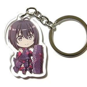 May include: A clear acrylic keychain featuring a chibi anime character with black hair, wearing red and black armour, holding a shield. The character has a smiling expression.
