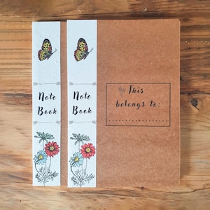 Cahier biodégradable | Papillon et marguerites / Abeille et marguerites | Paquet de 2 | Dos en papier pour graines plantables | ligné/vierge A5 | Respectueux de l'environnement.