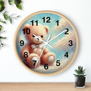 May include: A round wooden wall clock with a teddy bear illustration. The clock face has a blue and white sky background with white clouds. The numbers 1 through 12 are black and the clock hands are white.