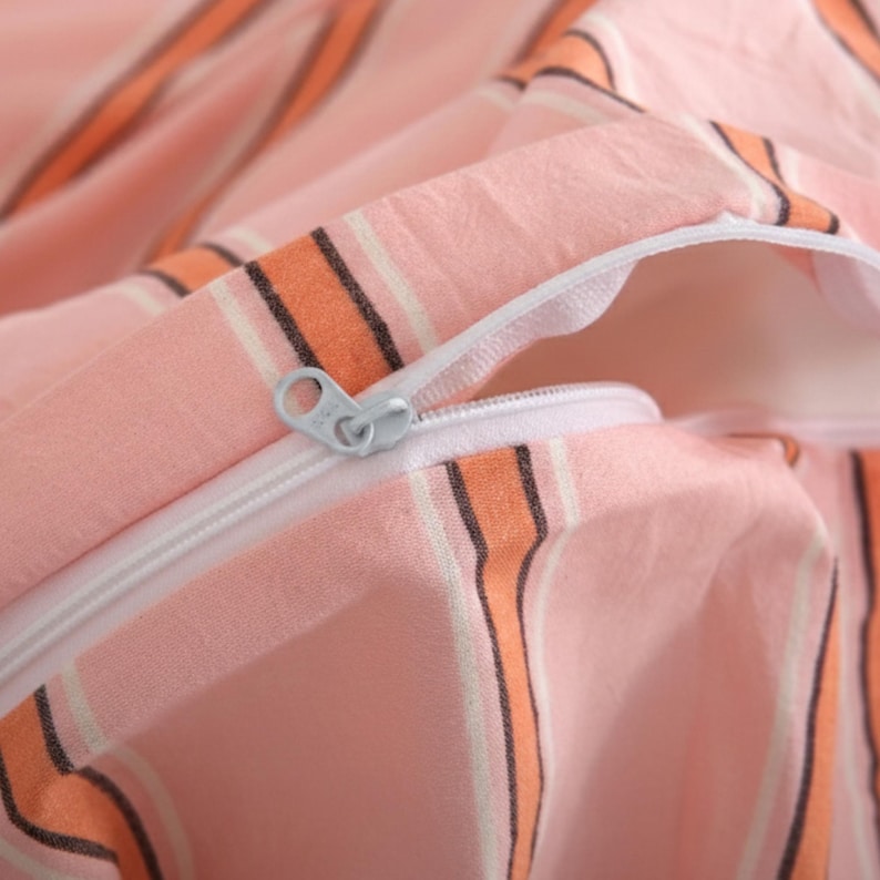 Close up of washed cotton striped duvet cover with hidden zipper closure