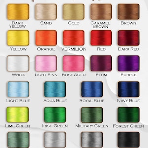 May include: A chart of thread colors with names for each color. The colors include dark yellow, sand, gold, caramel brown, brown, yellow, orange, vermilion, red, dark red, white, light pink, rose gold, plum, purple, light blue, aqua blue, royal blue, navy blue, lime green, Irish green, military green, forest green, teal green, light grey, dark grey, and black.