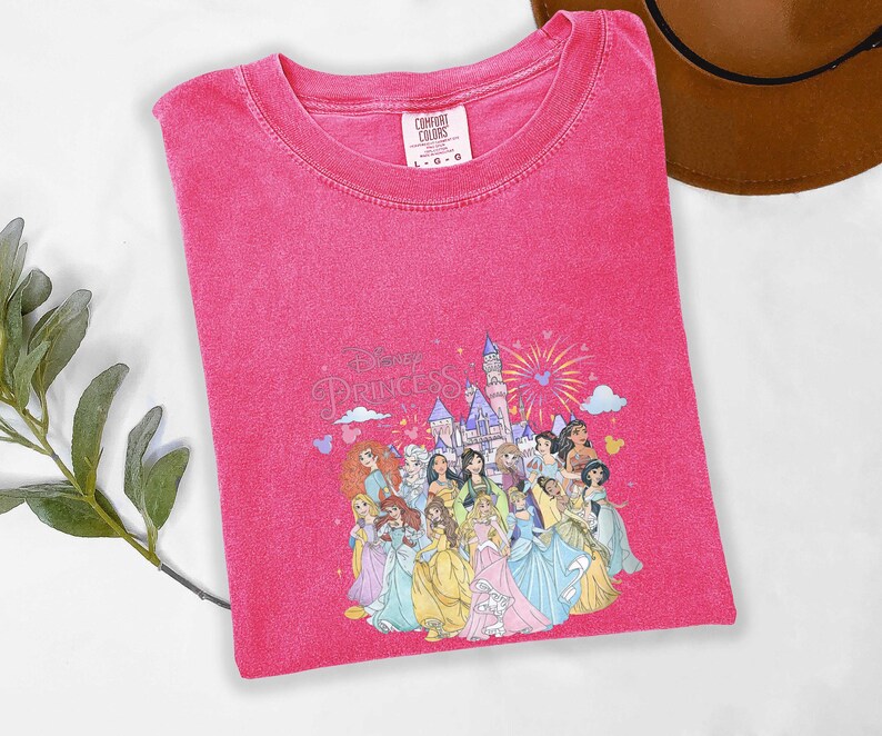 May include: A white ceramic mug with a black handle and the text "But First, Coffee" in a handwritten style. The mug is on a white surface. The mug is approximately 4 inches tall.