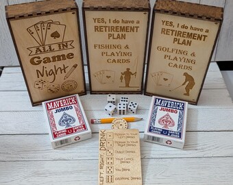 May include: Three rectangular wooden boxes with laser-engraved text and graphics, two decks of Maverick Jumbo playing cards, five white dice, a yellow pencil, and a wooden game card labeled Left, Right, Drink with dice roll instructions.