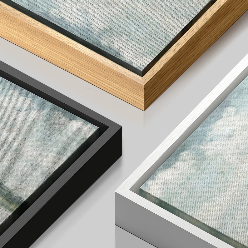 May include: Three different frames for canvas prints. The frames are made of wood, black, and white. The frames are all the same size and have a simple design.
