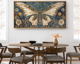 May include: A framed print of a large, intricate butterfly with wings in shades of white, blue, and gold. The butterfly is set against a dark blue background with floral accents.