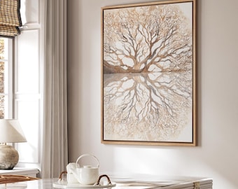May include: A framed watercolor painting of a tree with its reflection. The artwork features a symmetrical design with a light brown color palette. The painting is displayed on a white wall in a well-lit room.