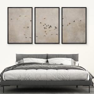 May include: Three framed prints of a flock of birds flying in a V formation against a light gray background.