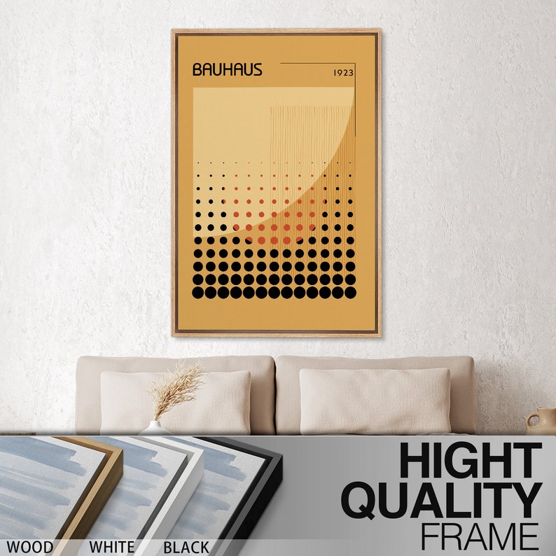 May include: A rectangular wall art print in a light wood frame featuring the text BAUHAUS and 1923. The graphic design displays a mustard yellow background with a grid of black and red dots, vertical lines, and a large semi-circular shape.
