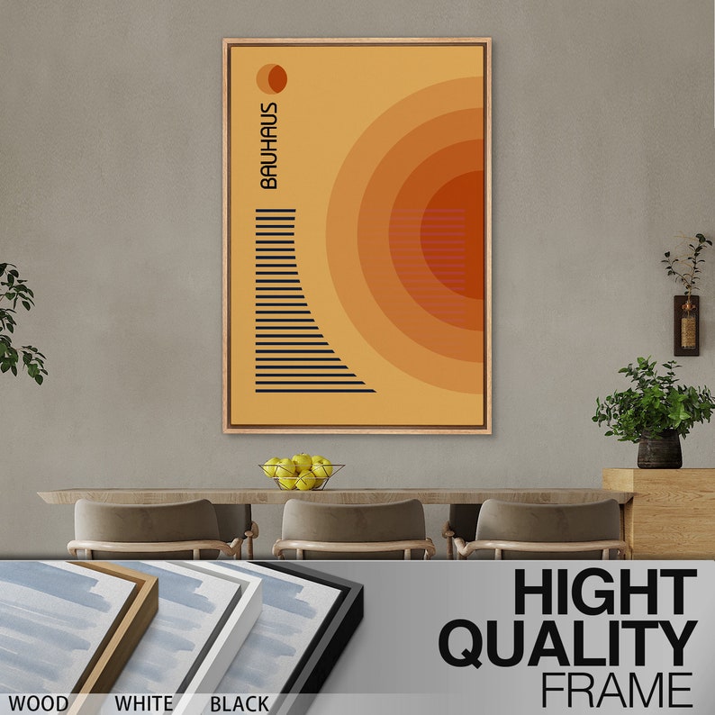 May include: A rectangular wall art print in a wooden frame featuring a yellow background with concentric orange circles, a small orange circle at the top, and a black geometric pattern of horizontal lines. The text BAUHAUS is printed vertically.