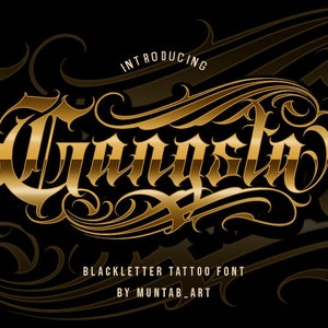 May include: Introducing "Gangsta", a blackletter tattoo font by Muntab_Art. The font is designed in a bold, gothic style with intricate details.