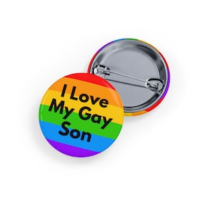 May include: A rainbow-coloured button with the text "I Love My Gay Son" in black.