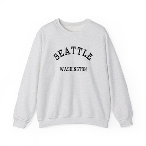 Seattle, Washington (Unisex Heavy Blend Crewneck Sweatshirt) Pacific Northwest, PNW Souvenir, Rainy City, USA Travel Gift - Black font