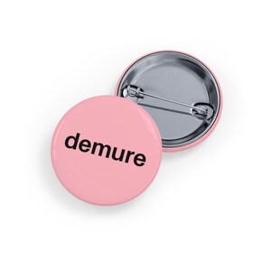 demure (round pin/button/badge) Lowkey Humor, Mindful Meme, Quiet & Playful Statement - Light soft pink