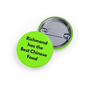 May include: Two round, lime green pinback buttons. One button is face up, displaying the text "Richmond has the Best Chinese Food" in black. The other button is face down, showing the silver pin backing.