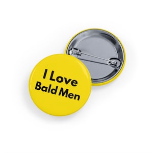 May include: Yellow button with the text "I Love Bald Men" in black.