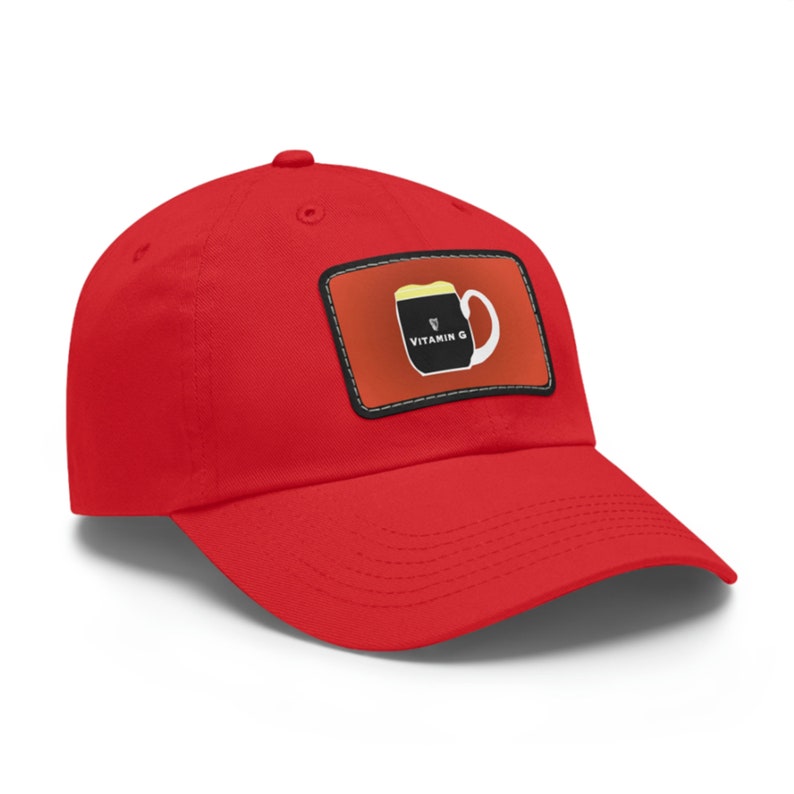 May include: Red baseball cap with a patch featuring a black and white illustration of a beer mug with the text "VITAMIN G" in white.