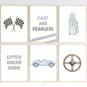 May include: Set of six framed watercolor prints with a racing theme. Includes checkered flags, a gas pump, a vintage car, a steering wheel, and text that reads "Fast and Fearless" and "Little Racer Dude". The color palette is primarily blue and white.