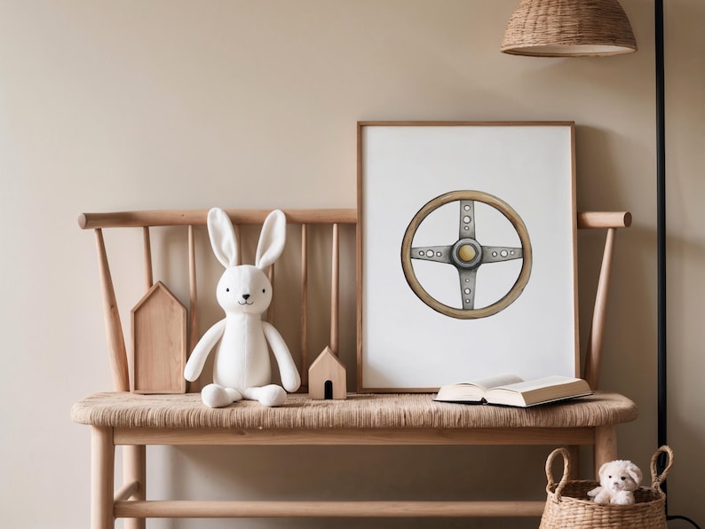 May include: A framed print of a vintage car steering wheel with a light wood grain and silver accents. The artwork is displayed on a wooden bench with a white stuffed bunny, wooden houses, and a woven basket.