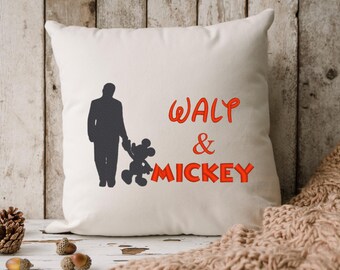 May include: White pillow with a silhouette of Walt Disney and Mickey Mouse. The text "Walt & Mickey" is embroidered in red.