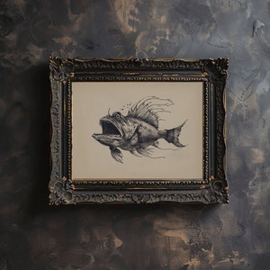 May include: A black and white drawing of a fish with a large mouth and sharp teeth, framed in a dark wood frame.