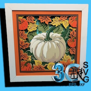 May include: A layered paper art piece featuring a white pumpkin with a green stem, surrounded by orange, yellow, and green autumn leaves and small pumpkins. The artwork is framed in a white, orange, and brown frame.