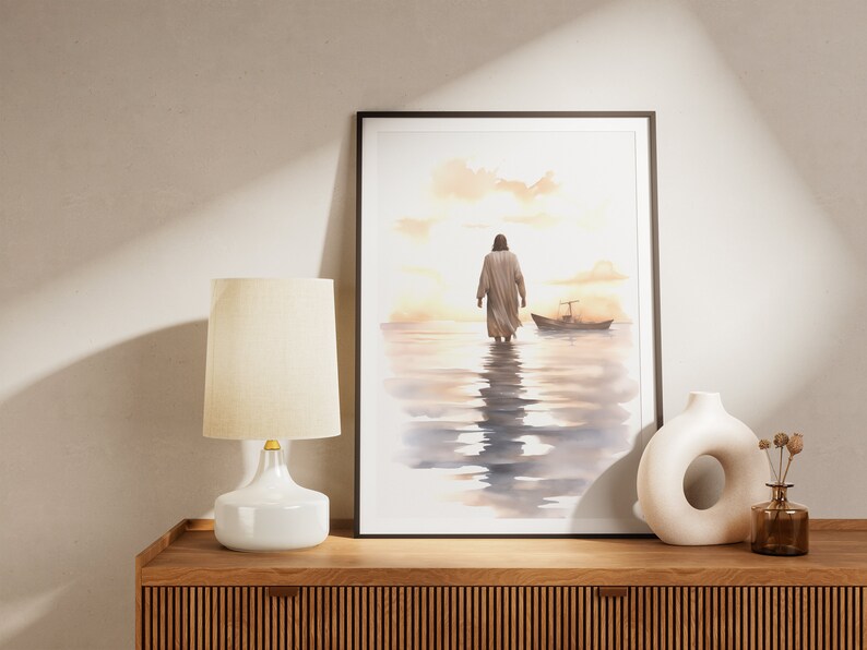May include: A watercolor painting of a person walking away from the viewer on a beach with a small boat in the distance. The painting is framed in a black frame and is hanging on a wall.