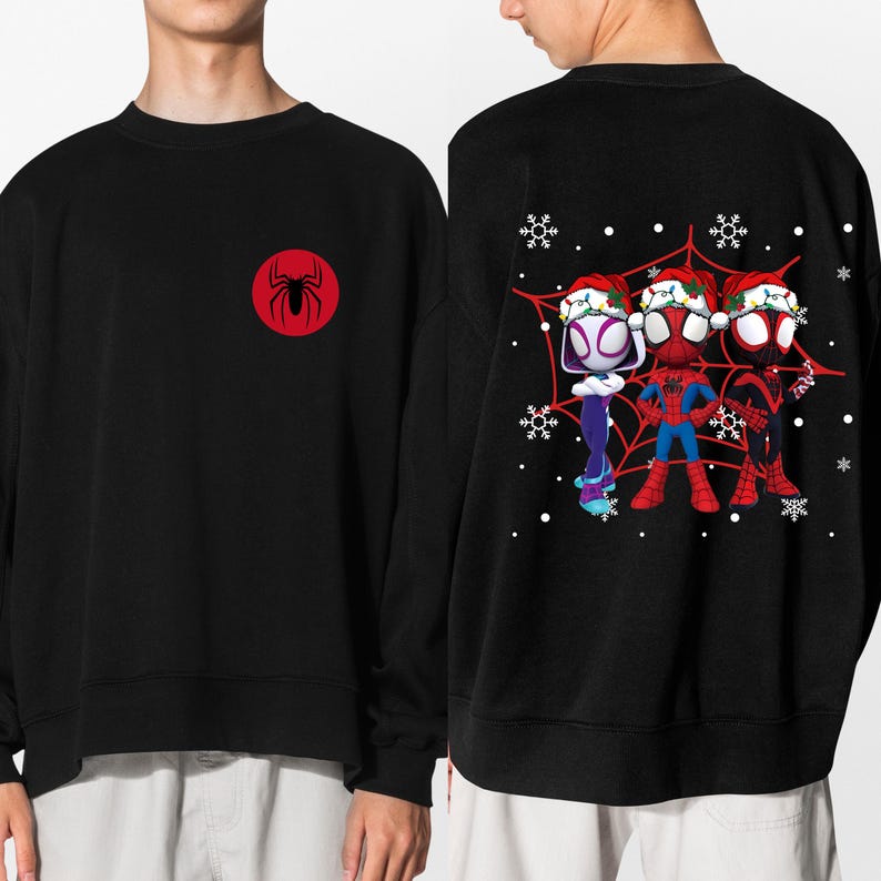 May include: Black sweatshirt featuring a red circle with a black spider emblem on the front. The back displays a graphic of three Spider-Man characters in Santa hats, set against a red web with snowflakes.