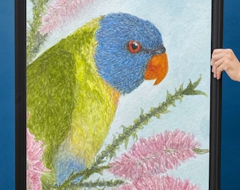 May include: A framed watercolor print of a rainbow lorikeet parrot with a blue head, green body, and orange beak. The parrot is surrounded by pink flowers and green foliage. The words "DIGITAL FILE" are in a pink starburst.