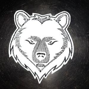May include: Black and white embroidered patch of a bear's face. The bear has a serious expression and its fur is detailed with stitching.