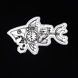 May include: A white embroidered patch of a steampunk shark with clockwork gears and the word "SHARK" on the side.