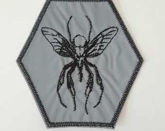 Reflecterende mug geborduurde opstrijkpatch