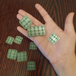 Heijastinmerkki Set med 9 st broderade lappar för hål på en jacka