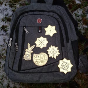 Broderad stryklapp med snöflingestjärna och säkerhetsreflex