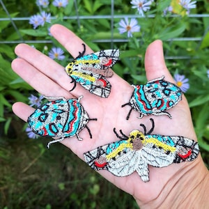 Picasso-mal och Picasso-insekter, 4 st broderade tygmärken