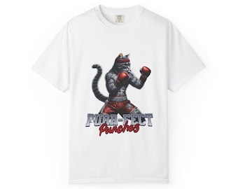 May include: White t-shirt featuring a gray cat in boxing attire, including red gloves and shorts, with a headband. The text "Pura-Fect Punches" is displayed below the cat in a stylized font.