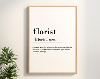 May include: A framed print with a white background and black text that reads "florist [florist] noun a magical wizard of petals and stems, capable of turning a bundle of flowers into a romantic gesture or a heartfelt apology."