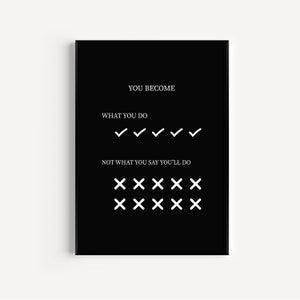 Puede incluir: Impresión artística enmarcada en negro con texto blanco. El texto dice "YOU BECOME WHAT YOU DO" seguido de marcas de verificación, y "NOT WHAT YOU SAY YOU'LL DO" seguido de marcas X. Una pieza motivacional para el hogar o la oficina.
