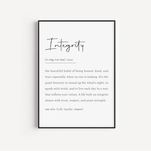 May include: A framed print with the word "Integrity" in elegant script at the top. Below, a definition of integrity is provided, including its pronunciation and a description of its meaning. The print is in a black frame.