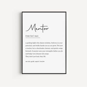 May include: A framed print with the definition of "Mentor" in black text on a white background. The definition includes the pronunciation, a description of a mentor's role, and related terms like guide and support.