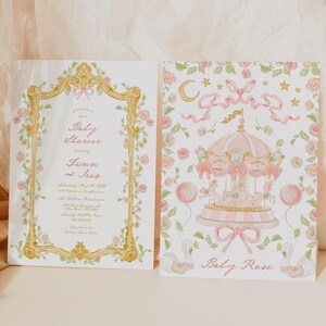 May include: A pink and gold baby shower invitation with a floral design. The invitation features a carousel with pink and white horses and a pink balloon. The text on the invitation reads "Baby Shower honoring Finn & Iris Saturday, May 20, 2023 at 4:00 in the afternoon The William Restaurant 123 Main Street Anytown, USA RSVP 555-555-5555 Registry at Target Baby Rose"