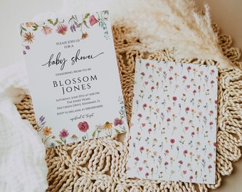 May include: A floral baby shower invitation with a white background and pink, purple, and yellow flowers. The text on the invitation reads "Please join us for a baby shower honouring mom-to-be Blossom Jones Saturday, June 15th at 4:00 PM The Jones Home 1562 Green Drive, Kissimmee, FL RSVP to Melanie at 000.000.0000"