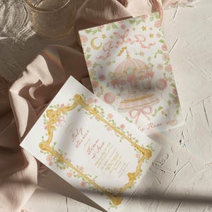 May include: A pink and gold baby shower invitation with a floral border and a carousel illustration. The invitation reads "Baby Shower honoring Finn & Iris".