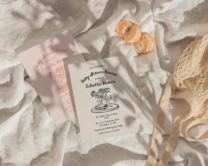 May include: A white card with black text announcing a baby shower brunch for Liliette Parker. The card features a line drawing of a bouquet of flowers and a stack of books on a tray.