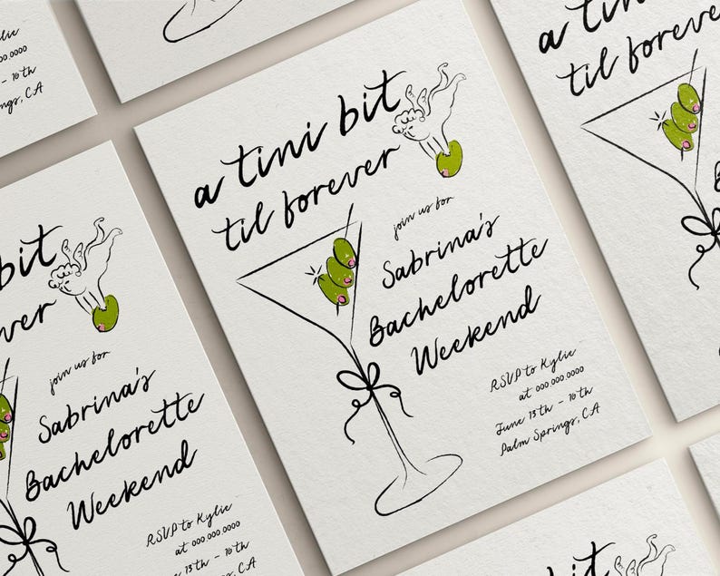 May include: A white invitation card with black calligraphy that reads "a tini bit til forever" and "join us for Sabrina's Bachelorette Weekend". The card features a black and white illustration of a martini glass with green olives and a small angel with a halo.