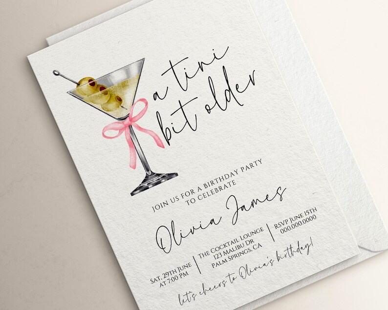 May include: A white invitation card with a martini glass illustration and pink ribbon. The text reads "a tini bit older" and "Join us for a birthday party to celebrate Olivia James". The invitation details include the date, time, location, and RSVP information.