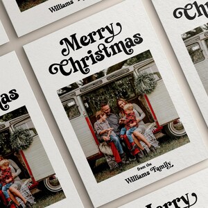 May include: White Christmas cards with a family photo inside a vintage camper. The cards have the text "Merry Christmas" in a retro font, and "from the Williams Family" at the bottom.