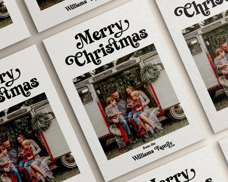 May include: White Christmas cards with a family photo inside a vintage camper. The cards have the text "Merry Christmas" in a retro font, and "from the Williams Family" at the bottom.