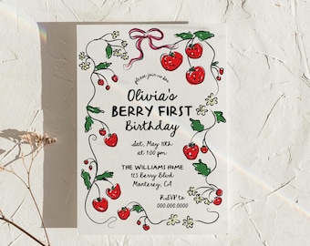 May include: A white invitation with a red and green strawberry design. The text reads "Please join us for Olivia's Berry First Birthday, Sat, May 10th at 1:00 pm, The Williams Home, 123 Berry Blvd, Monterey, CA, RSVP to 000.000.0000".