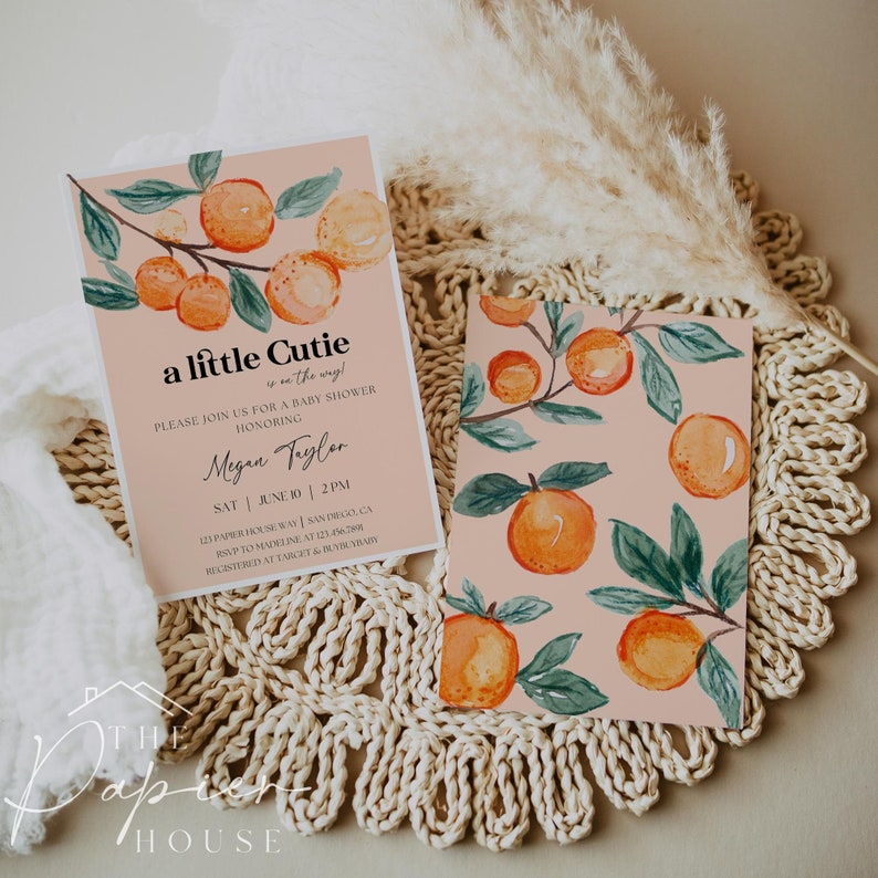May include: A baby shower invitation with a peach background and orange citrus fruit illustration. The text reads "a little cutie is on the way!" and includes the name "Megan Taylor" and the date and time of the event.