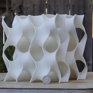 8x8 3D-printed gyroid aquarium cave with flowing patterns and openings. Ideal for fish and shrimp breeding, this white reef-safe sculpture adds a coral reef look. Perfect habitat for medaka, cichlids, and other aquatic pets.